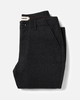 folded flatlay of The Carnegie Pant in Coal Herringbone Wool