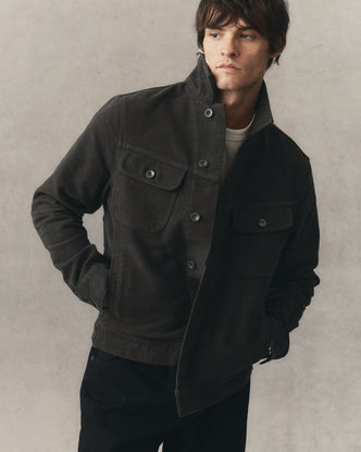 fit model showing off The Long Haul Jacket in Faded Black Washed Moleskin