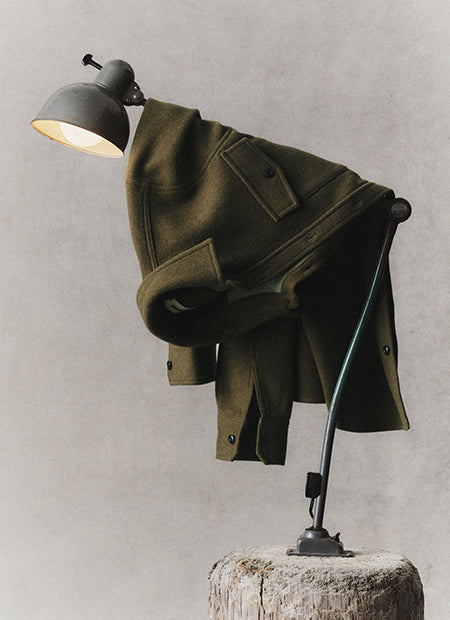 editorial image of The Maritime Shirt Jacket hanging on a lamp, by Taylor Stitch